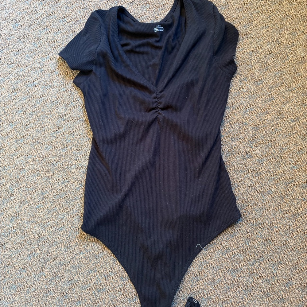Black Ribbed One-Piece Bodysuit
